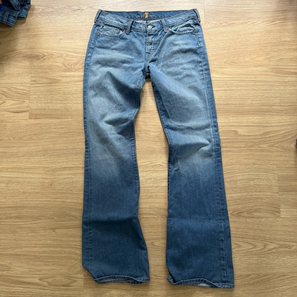 7 For All Mankind Blue Flare Jeans with Slight Distressed Detail